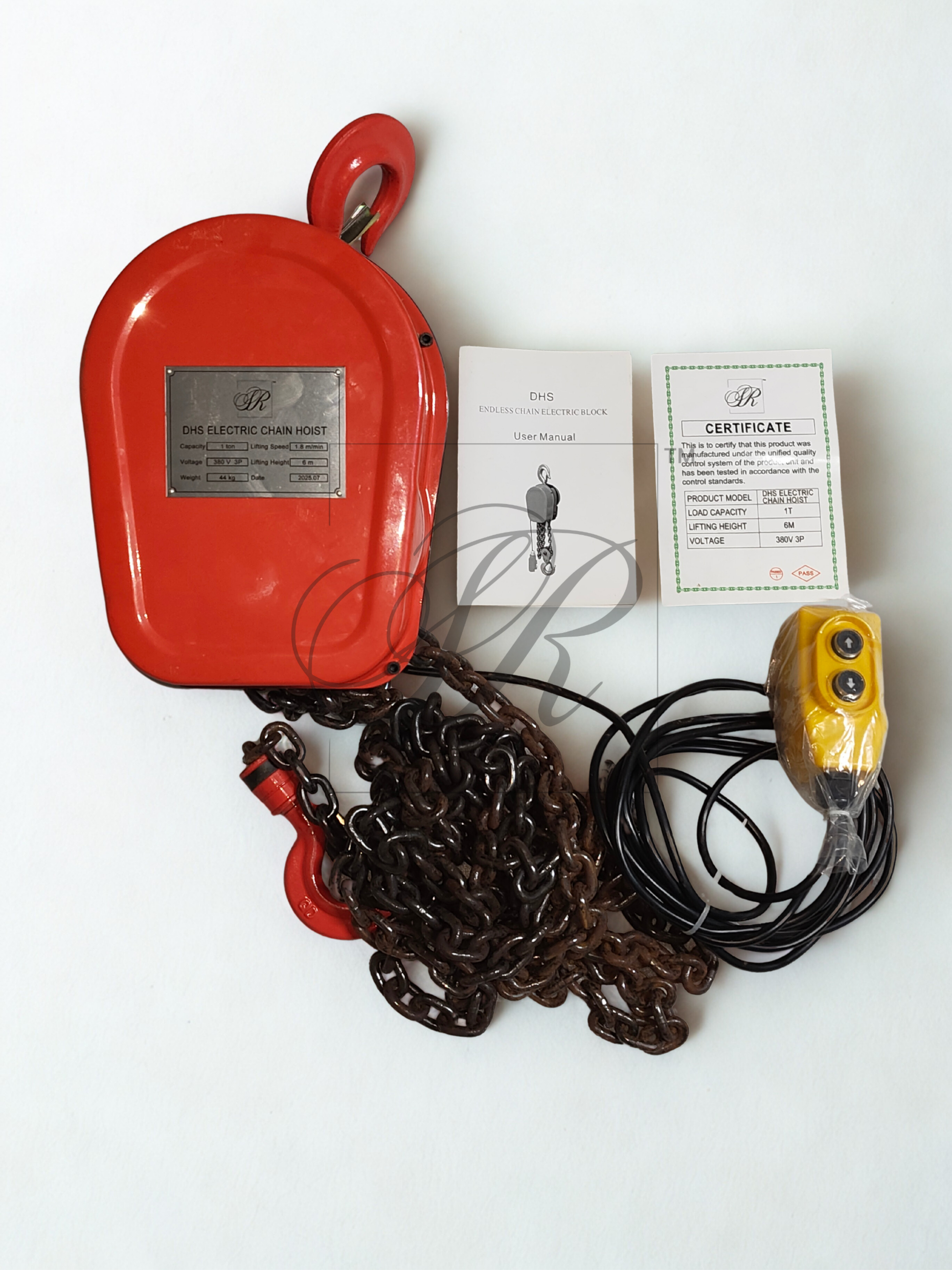 Red electric chain hoist with chain, remote control, and certificates on a white background